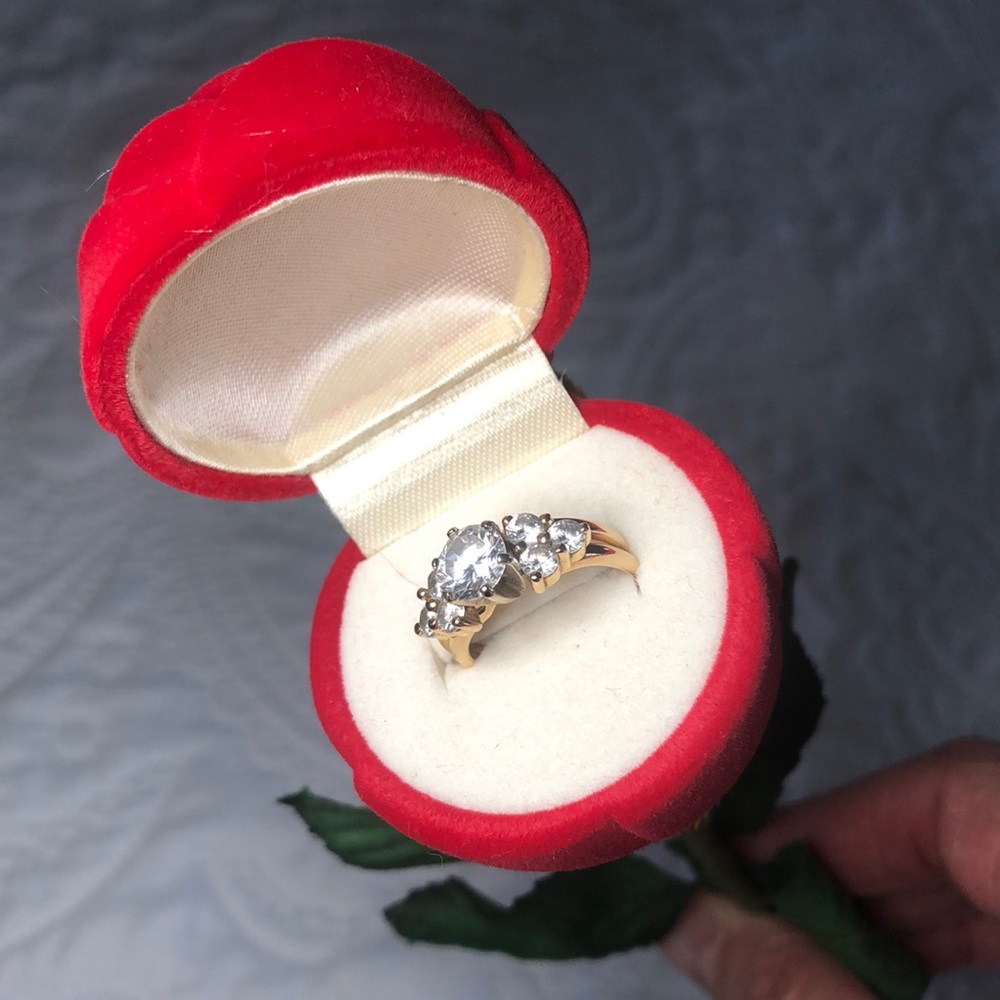 Two 14k gold rings w CZs.